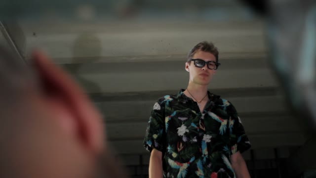 Man In Glasses Speaks With A Man Close-up