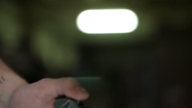Man Cocks The Gun Close-up
