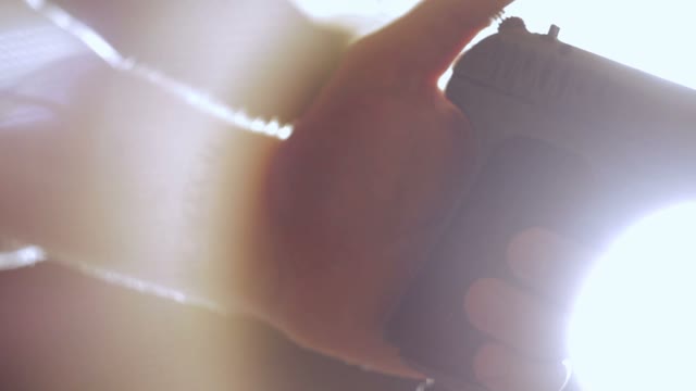 Man Cocks The Gun Close-up