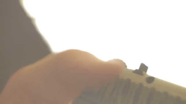 Man Cocks The Gun Close-up