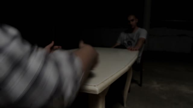Man Puts Pistol On The Table