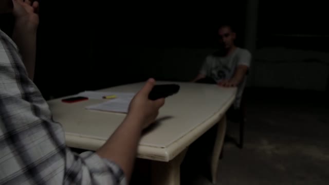 Man Puts Pistol On The Table