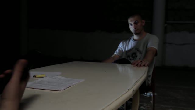 Man Puts Pistol On The Table