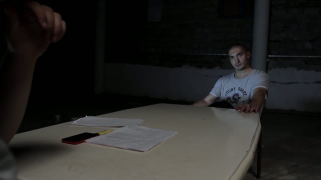 Man Puts Pistol On The Table