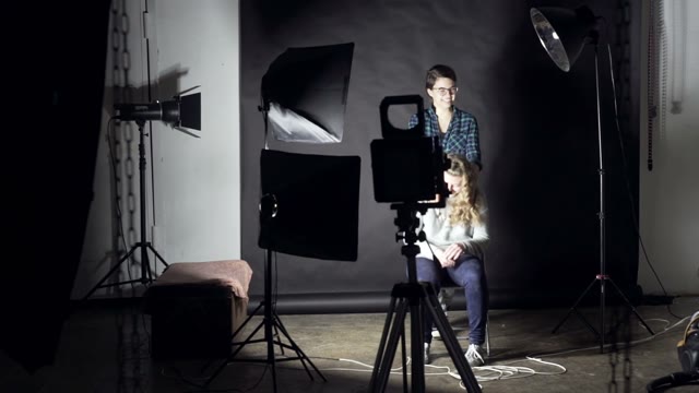 Man Photographs Of Two Girls On A Retro Camera