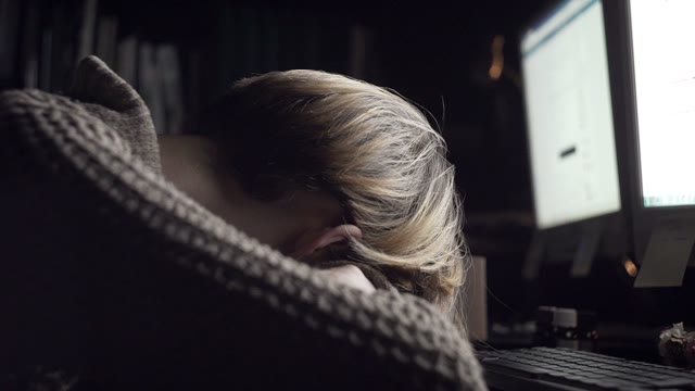 Girl Lying At Office Desk Close-up