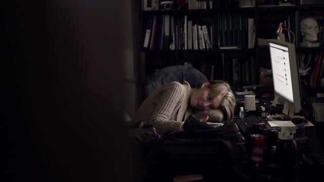 Girl Lying At Office Desk With A Tablet