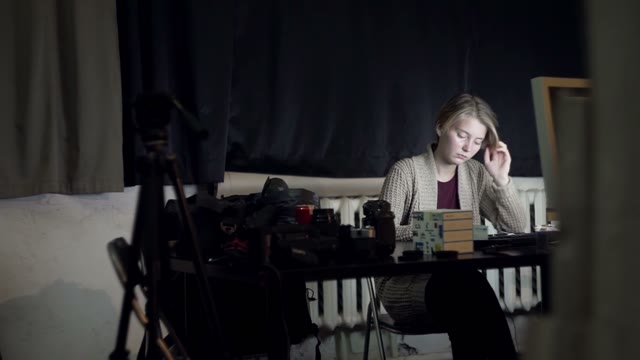 Girl Sitting At Office Desk With A Tablet