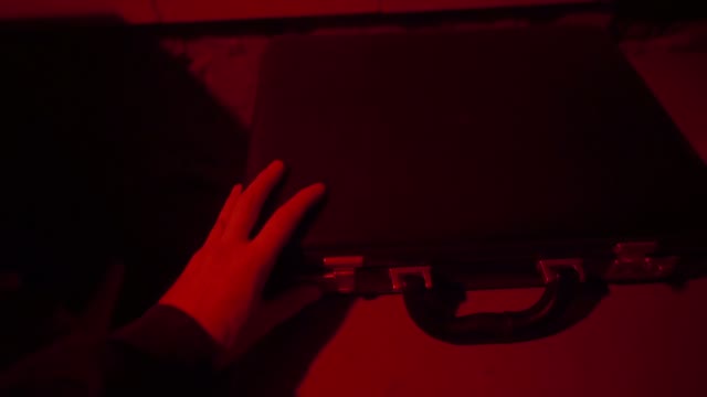 Man Opens The Suitcase Close-up