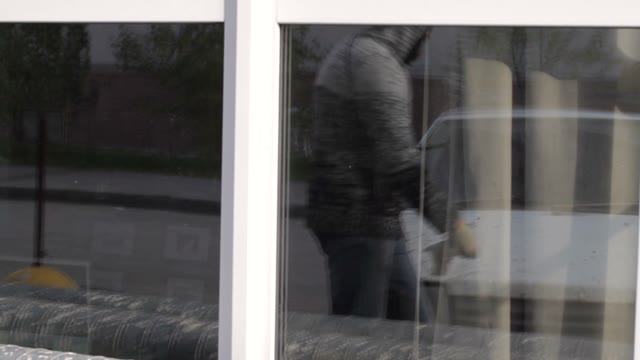 Reflection Of A Young Man Repairing Car