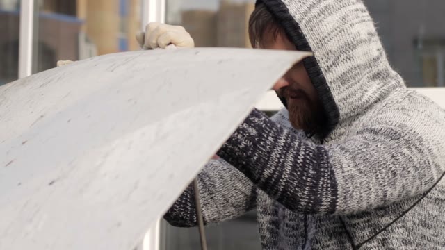 Man Pulls Out A Ring Air Filter From A Car Close-up