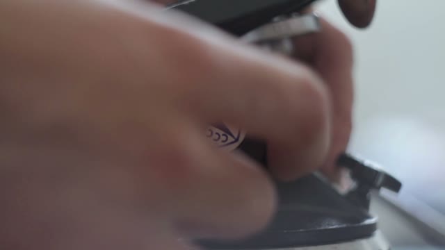 Male Hand Twist Tripod Close-up