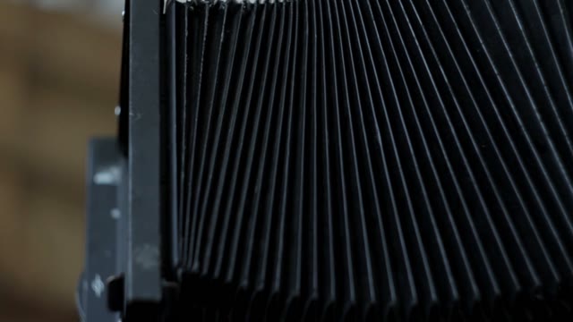 Men's Hands Dismantle Camera Close-up