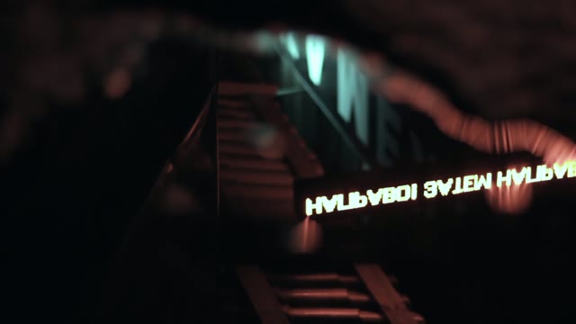 Reflection Of Light Advertising In A Puddle