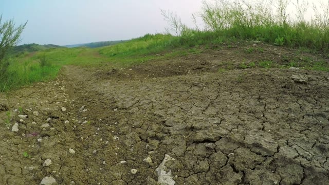 Radio-controlled Machine Rides On The Dirt Road