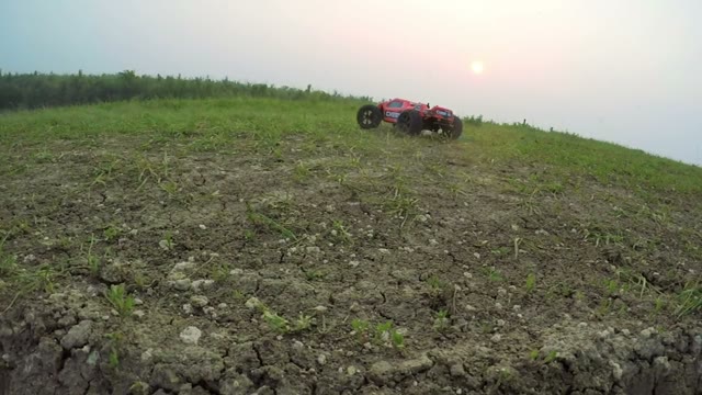 Radio-controlled Machine Rides On The Field And Stops Near The Camera