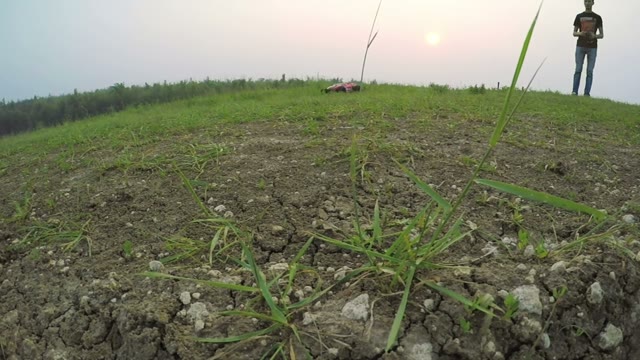 Radio-controlled Machine Car Knocks Down The Camera