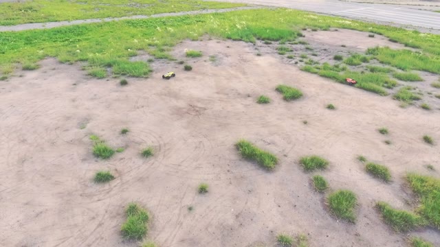 Two Cars On The Radio Control Rides On The Field
