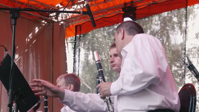 The Man With The Flute Leafing Through The Notes