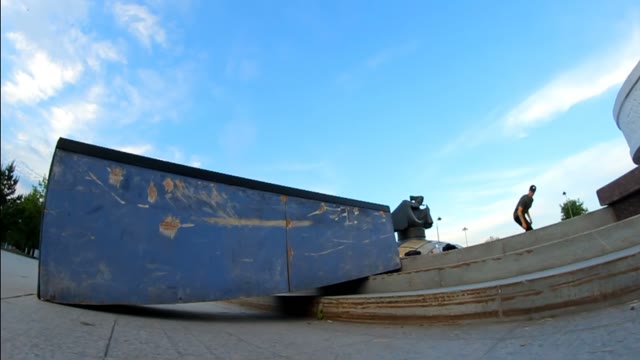 Guy On A Skateboard Doing A Trick On The Brink And Falls