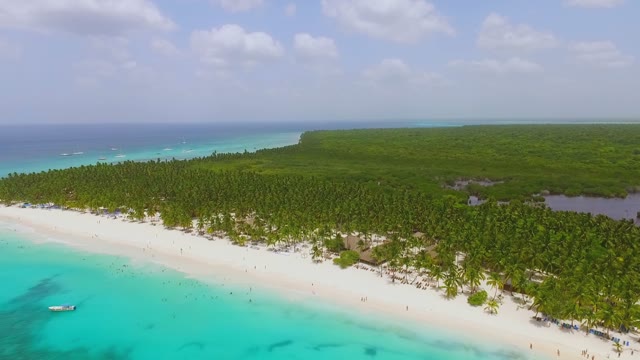 A Beautiful View From The Drone On A Green Island With White Sand Beaches And