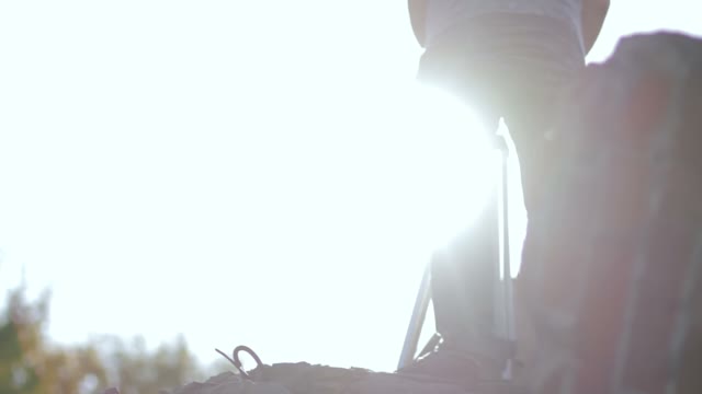 Man Carries Retro Camera To Another Location
