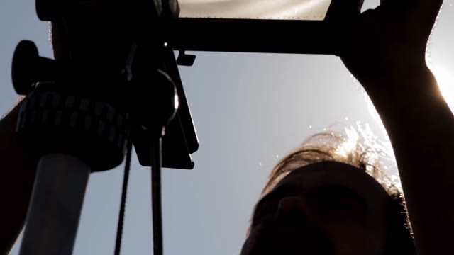 Man Adjusts The Retro Camera Close-up