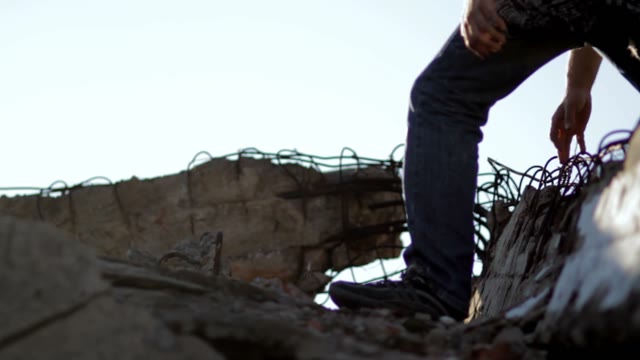 Man Walks Through The Ruins