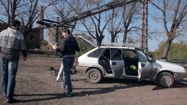 Man Looking For Something In The Car