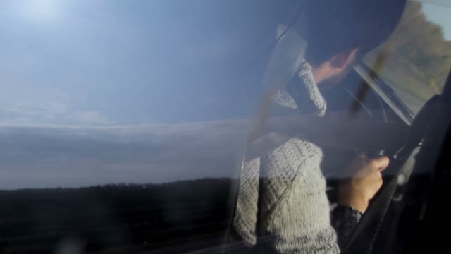 Reflections Of A Driver In A Moving Car Window