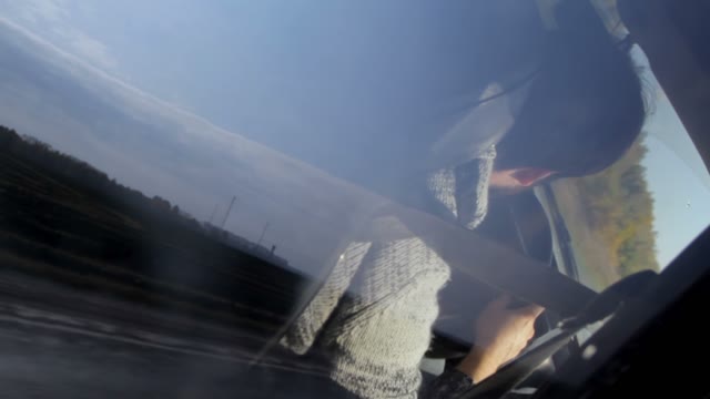 Reflections Of A Driver In A Moving Car Window