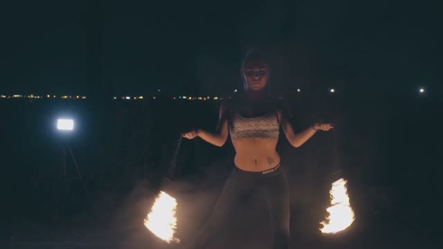 Adult Blond Woman In A Fire Show At Night
