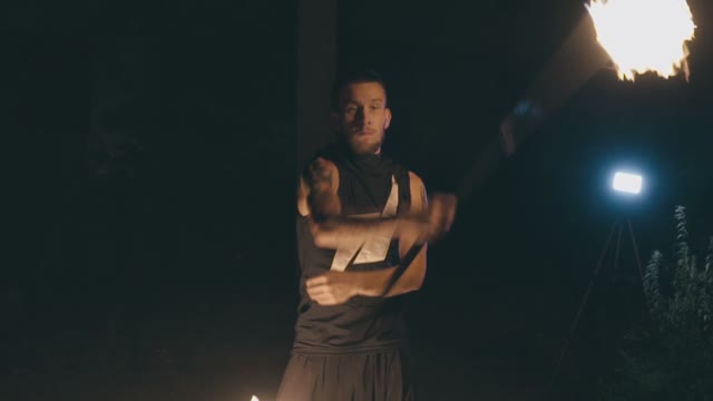 Attractive Muscular Guy In A Fire Show At Night