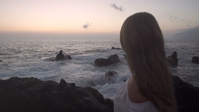 Female Looking At A Sea Swash