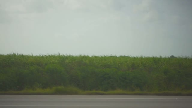 View Of The Road With Cars Along A Beautiful Rural Landscape