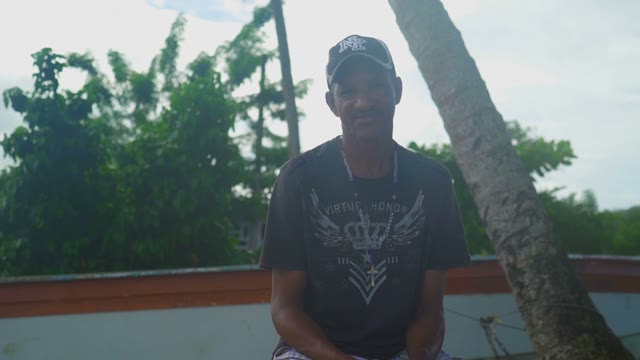 Yhe Local Dark-skinned Resident Of The Dominican Republic On A Background Of