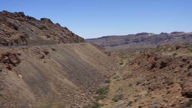 Car Moving Through A Mountain Road