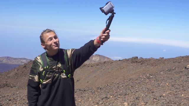 Man Filming Himself On A Mountain