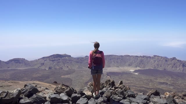 Girl On The Top Of A Mountain