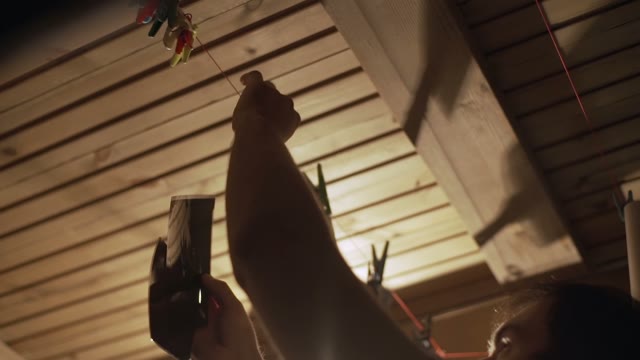 Man Hanging Pictures Close-up