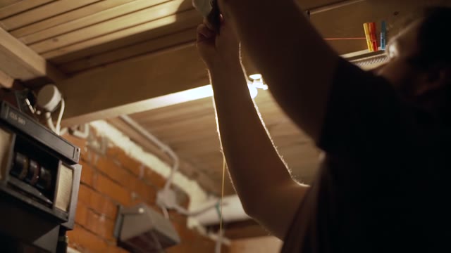 Man Hanging Pictures Close-up