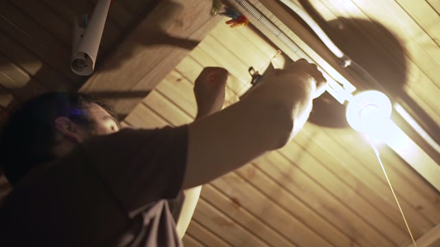 Man Hanging Pictures Close-up