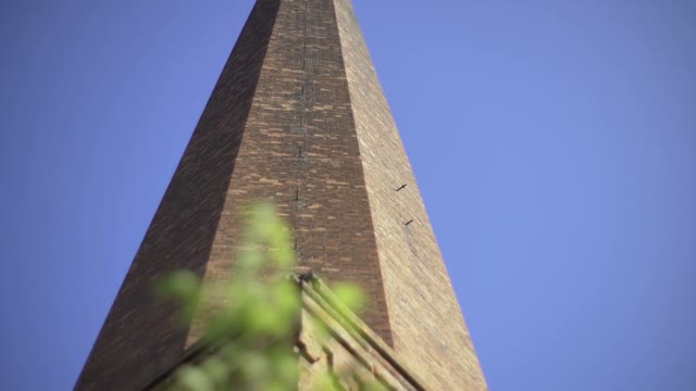 Man Photographs Chimney On The Retro Camera Close-up