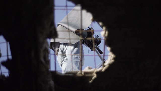 Surveillance Of Photographer Through A Hole In The Floor