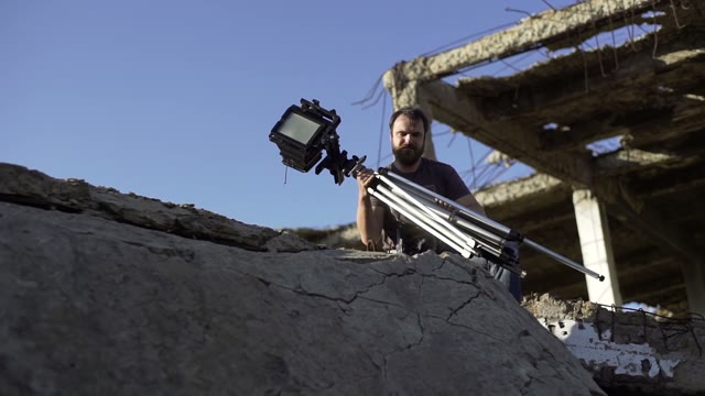 Man Puts Retro Camera Among The Ruins