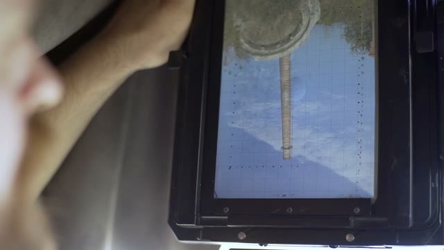 Man Photographs On Retro Camera. The View From The Camera Close-up