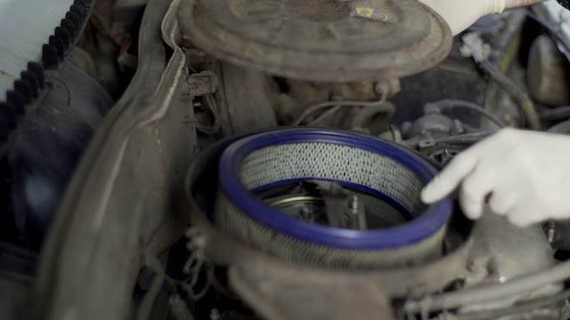 Man Changes The Car's Air Filter Close-up