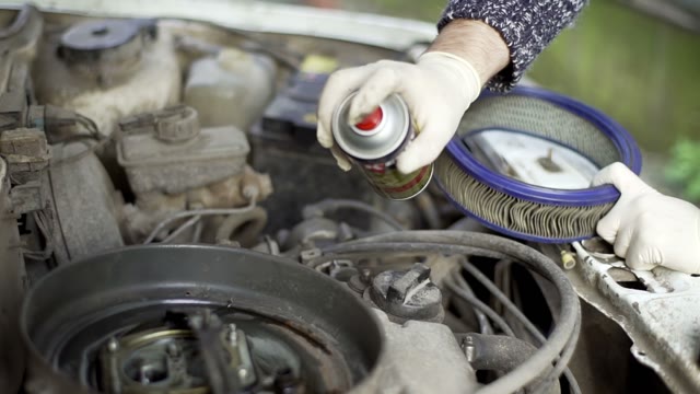 Man Changes The Car's Air Filter Close-up