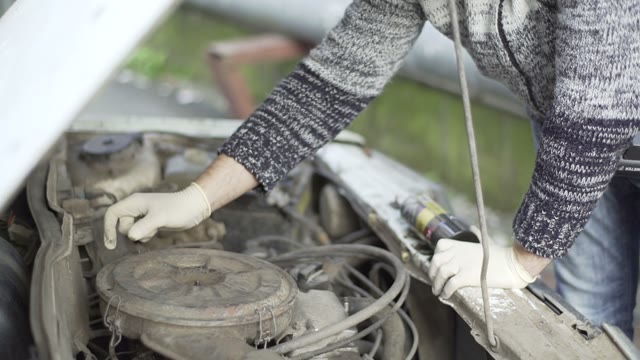 Man Changes The Car's Air Filter Close-up