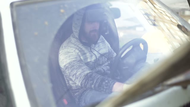 Man Starts A Car Engine